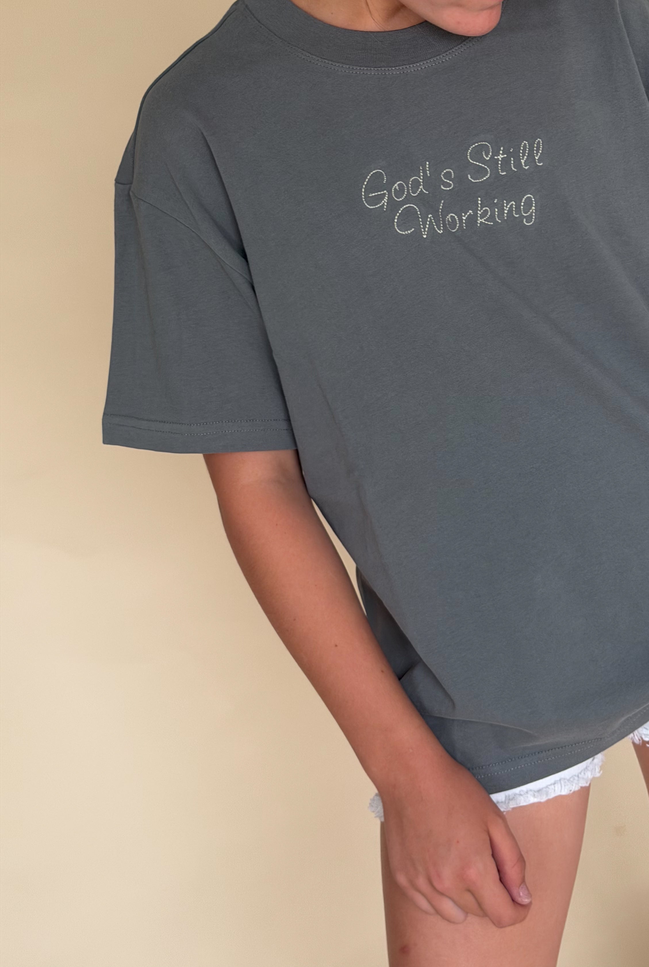 God's Still Working Tee